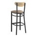 A Lancaster Table & Seating black wood bar stool with a taupe cushion and driftwood back.