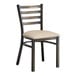 A Lancaster Table & Seating black metal ladder back chair with a light gray cushioned seat.