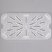 A white translucent plastic Cambro drain tray with holes.