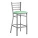 A Lancaster Table & Seating ladder back bar stool with a seafoam green cushion.