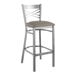 A Lancaster Table & Seating clear coat finish cross back bar stool with a dark gray vinyl padded seat.