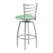 A Lancaster Table & Seating swivel bar stool with a seafoam green padded seat.