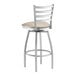 A Lancaster Table & Seating silver bar stool with a light gray cushion.