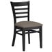 A Lancaster Table & Seating black wood ladder back chair with a taupe vinyl seat.