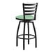A black Lancaster Table & Seating bar stool with a seafoam vinyl padded seat.