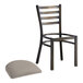 A Lancaster Table & Seating distressed copper ladder back chair with dark gray cushion on a white background.