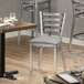 Lancaster Table & Seating Clear Coat Finish Ladder Back Chair with 2 1/2" Light Gray Vinyl Padded Seat Main Thumbnail 1