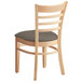 A Lancaster Table & Seating wooden ladder back chair with a taupe cushion.