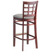 A Lancaster Table & Seating mahogany wood bar stool with a light gray cushion seat.
