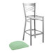 A Lancaster Table & Seating cross back bar stool with a seafoam vinyl padded seat on a white background.