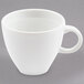 An Arcoroc white espresso cup with a handle.