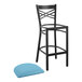 A Lancaster Table & Seating black cross back bar stool with a blue cushion.
