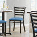 Lancaster Table & Seating Distressed Copper Finish Ladder Back Chair with 2 1/2" Blue Vinyl Padded Seat Main Thumbnail 1
