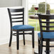 Lancaster Table & Seating Black Finish Wooden Ladder Back Chair with Blue Padded Seat Main Thumbnail 1