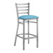 A Lancaster Table & Seating ladder back bar stool with a blue vinyl cushion.