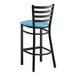 A Lancaster Table & Seating black ladder back bar stool with a blue vinyl padded seat.