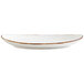 A Fortessa bright white china coupe platter with an Earth hue rim.