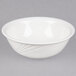A CAC Garden State bone white porcelain bowl with a curved edge.