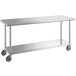 A long stainless steel work table with casters and a shelf.