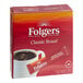 A box of 12 Folgers Classic Roast instant coffee packets.