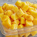 A bowl of Dole IQF mango chunks.