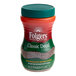 A close up of a plastic container of Folgers Classic Decaf Instant Coffee with a green lid.