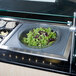 A Cambro salad bowl holder with a bowl of salad on a counter.