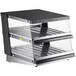 A black and silver ServIt countertop heated display case with slanted shelves.