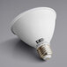 A white Eiko light bulb with black text reading "Eiko 10W 850 Lumens"