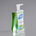 A Dial bottle of Fresh Pear antibacterial foaming hand soap in a green and white package.