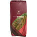 A bag of Cacao Barry Plein Arome cocoa powder with a leaf on it.