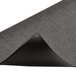A black rubber Notrax anti-fatigue mat with a curved corner.