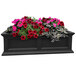 A Mayne Fairfield black rectangular planter with pink and red flowers.