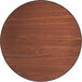 A Lancaster Table & Seating round wood table top with a brown wood surface and lines.