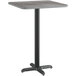 A Lancaster Table & Seating bar height table with a black base and slate gray top.