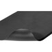 A close-up of a black Notrax Superfoam Revive anti-fatigue mat with a curved edge.