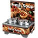 A Vollrath countertop soup warmer with a bowl of soup with pasta and vegetables in it and a sign that says "Soup"