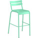 A green barstool with a white backrest.