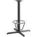 A Lancaster Table & Seating black metal bar height table base with round foot ring.