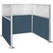 A Versare Hush Panel Caribbean U-Shape cubicle with blue fabric panels.