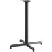 A Lancaster Table & Seating black metal bar height table base with a pedestal column.