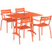 An orange table with an umbrella hole and four chairs set.