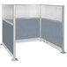 A Versare Hush Panel U-shaped office cubicle with blue fabric.