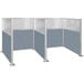 A Versare Hush Panel double cubicle with powder blue panels and silver frames.
