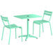 A Lancaster Table & Seating outdoor table in seafoam with two chairs.
