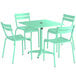 A Lancaster Table & Seating seafoam green table with four chairs on an outdoor patio.