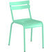 A mint green plastic chair with metal legs.