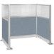 A Versare Hush Panel U-Shape cubicle with blue and white fabric panels.