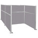 A grey Versare Hush Panel cubicle with silver metal posts.
