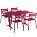 A red Lancaster Table & Seating outdoor table with chairs.